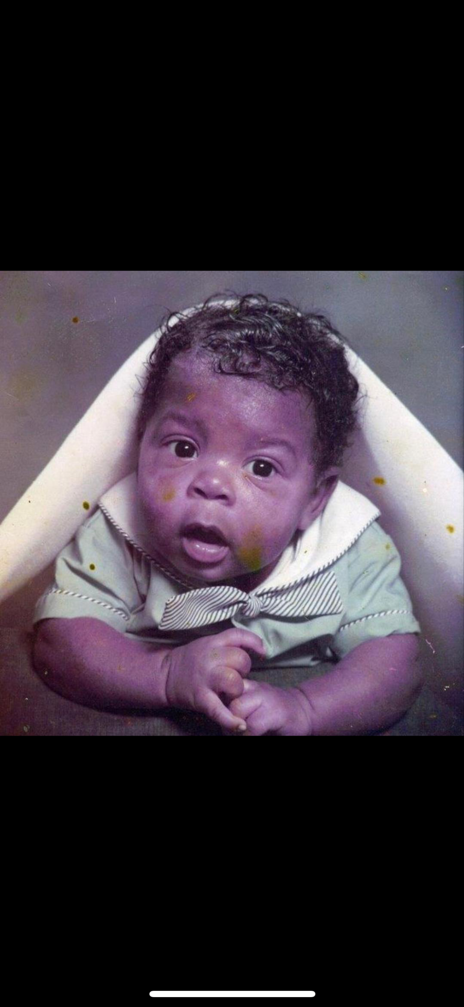 A baby portrait of Ant looking toward the camera